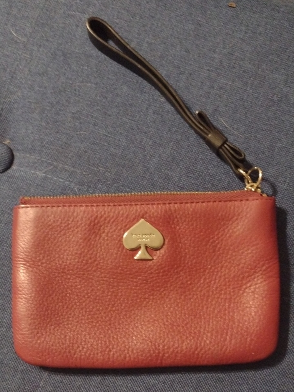 kate spade red leather wristlet with black strap